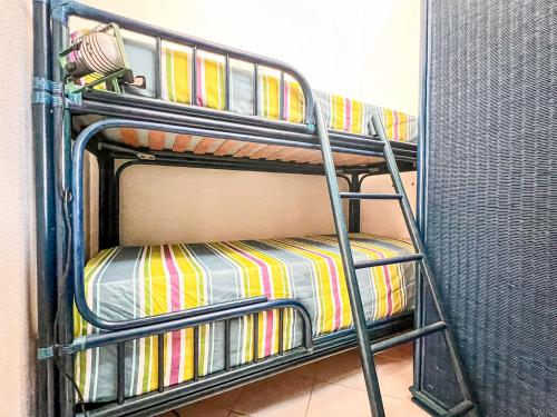 a set of bunk beds in a room at Cala Reale 101 in Capo Testa