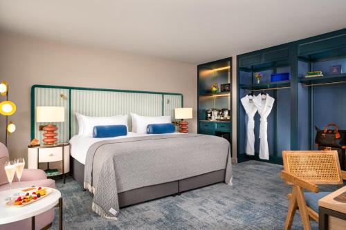 a bedroom with a large bed with blue cabinets at The Green in Dublin