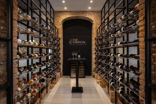 a wine store with a wall of wine bottles at Land of Alandroal in Alandroal