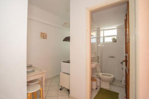 a bathroom with a toilet and a sink at A4 - Rosemary Apartment in Nydri
