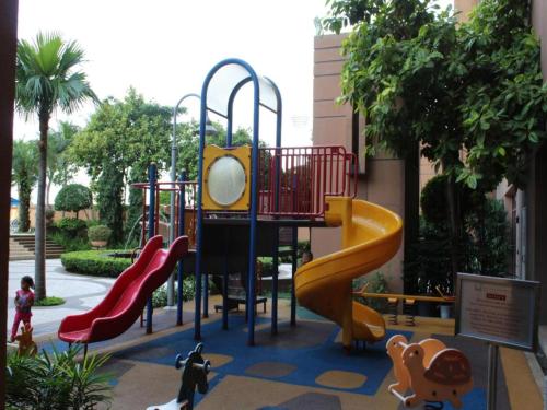 a playground with a slide in a park at The Hotel and Apartment At Berjaya Times Square in Kuala Lumpur
