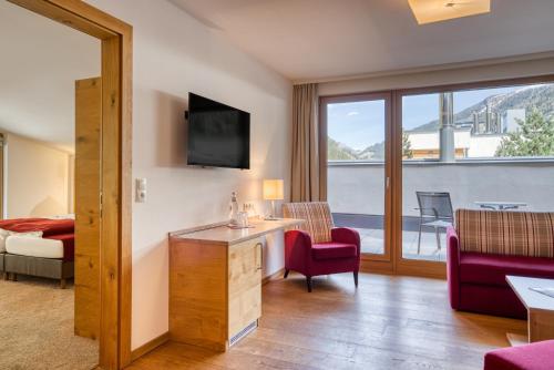 a hotel room with a view of a balcony at Mallaun Hotel.Erlebnis in See