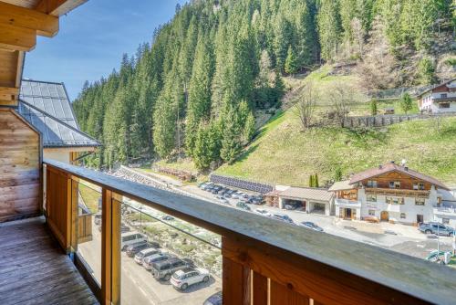 a view from the balcony of a cabin with cars parked at Mallaun Hotel.Erlebnis in See
