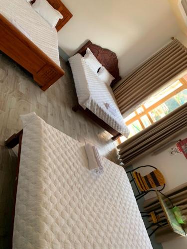 Sen Đá Houseにあるベッド