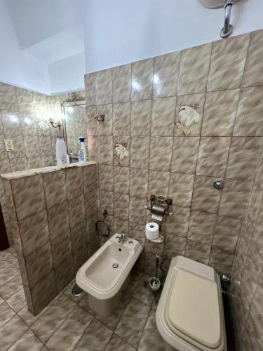 a bathroom with a toilet and a sink at Affittacamere da Elio e Renata in Calvi dellʼ Umbria