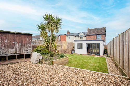 a home with a backyard with a yard with a yard sidx sidx at Host & Stay - Emilyn House in Whitburn