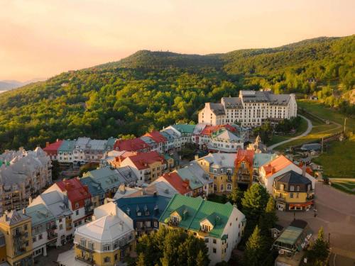 an aerial view of a town with a mountain at Fairmont Tremblant in Mont-Tremblant
