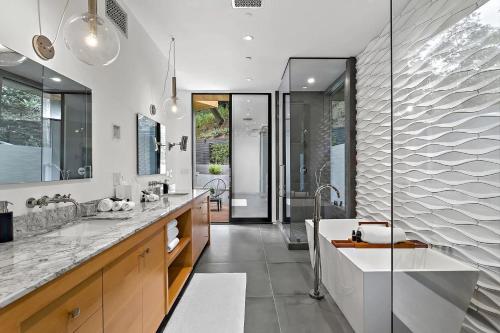 a bathroom with a large sink and a shower at Stunning 5 Bedroom Villa with Private Pool in Los Angeles