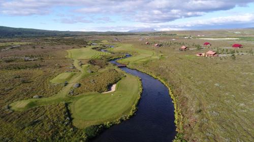 an aerial view of a golf course and a river at Geysir Cabins - Golden Circle Cabin only 800m from Geysir in Selfoss