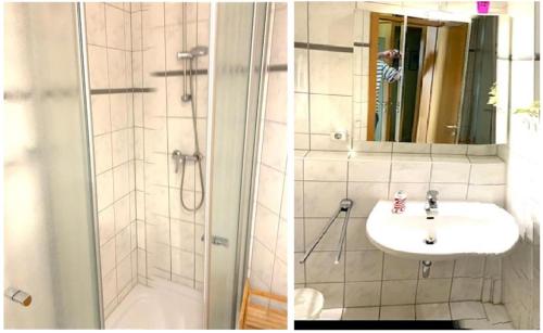 La salle de bains est pourvue d'un lavabo et d'une douche. dans l'établissement Ferien Wohnungen Arkonablick, à Juliusruh