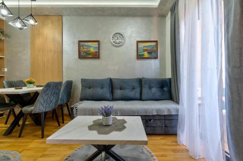 a living room with a couch and a table at Akik in Zlatibor