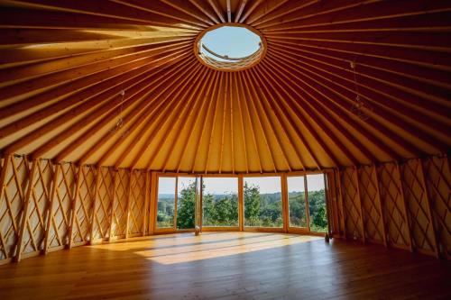 a large room with a large window in a yurt at Jurta Rokitek61 in Sandomierz
