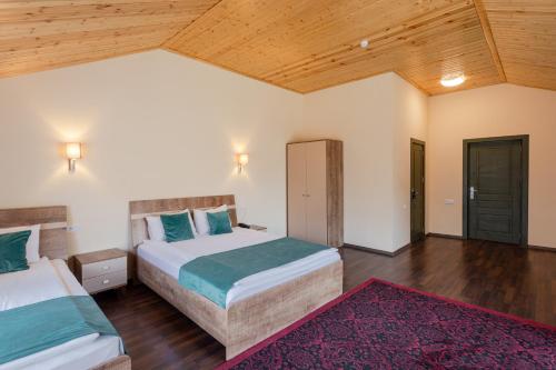 Katil atau katil-katil dalam bilik di Maajid Quba Hotel&Restaurant Sanatorium