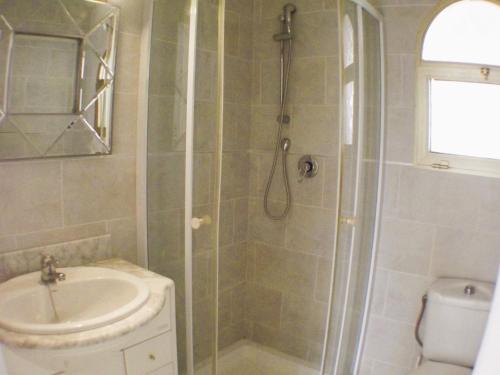 a bathroom with a shower and a sink at Casa Ladera in Las Lagunas Mijas