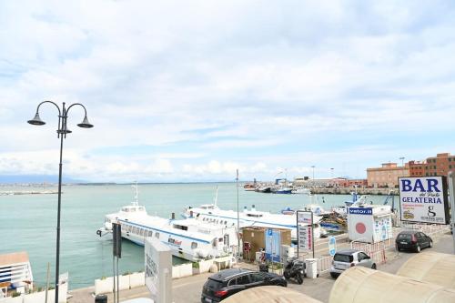 a group of boats docked in a harbor at The sea view at the port of Anzio in Anzio