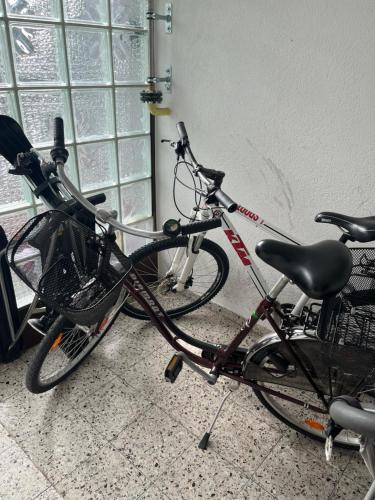 two bikes are parked next to a window at Small attic apartment close to Lake and Mountains Fussach in Fußach