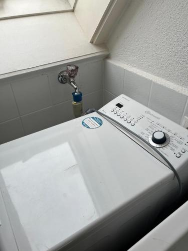 a close up of a toilet in a bathroom at Small attic apartment close to Lake and Mountains Fussach in Fußach