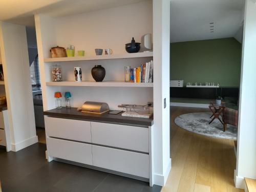 A kitchen or kitchenette at Business Accommodation 'Urban Living' Intimate
