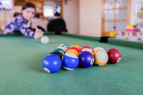 a group of billiard balls on a pool table at Willa Piękne Widoki in Ząb