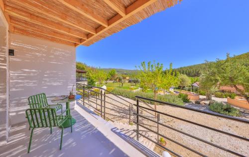 a patio with a chair and a table on a balcony at Kairos Hotel in Kas