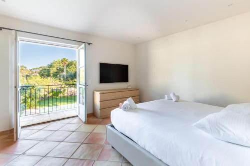 En eller flere senge i et værelse på Magnifique Villa avec piscine et hammam