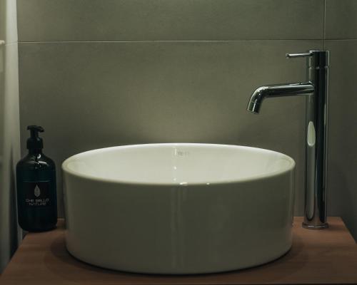 a white sink with a faucet in a bathroom at CHE BELLO NATURE in Preveza