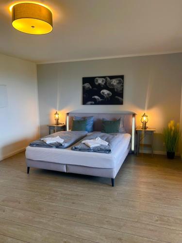 a bedroom with a large bed in a room at Ostseehaus Dreesen in Timmendorfer Strand