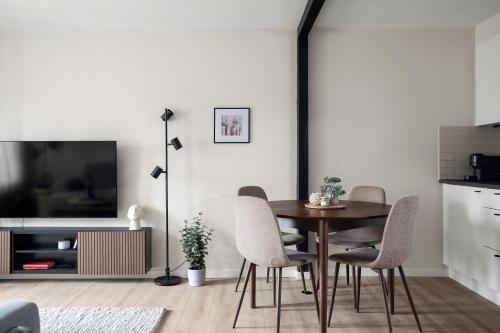 a dining room with a table and chairs at Scandinavian Suites Stockholm in Stockholm