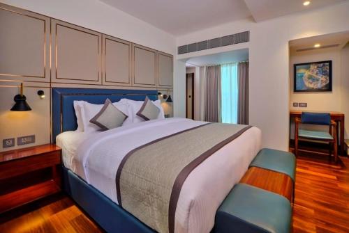 Ένα ή περισσότερα κρεβάτια σε δωμάτιο στο Pride Hotel Udaipur