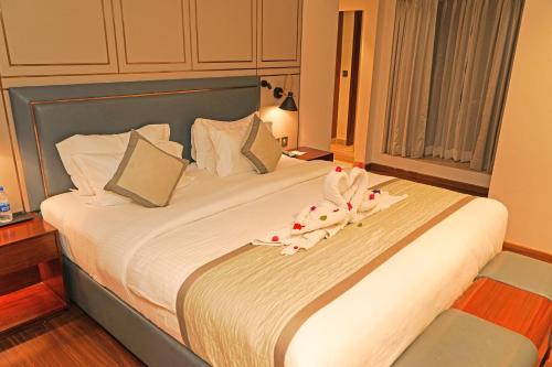 Ένα ή περισσότερα κρεβάτια σε δωμάτιο στο Pride Hotel Udaipur