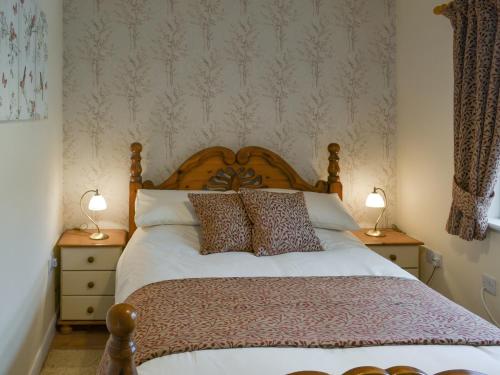 Tempat tidur dalam kamar di Limewood Lodge