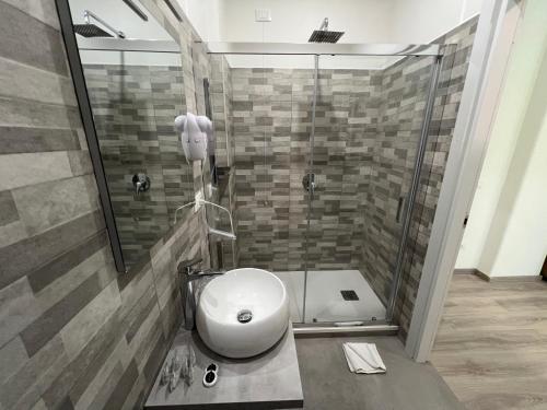 a bathroom with a sink and a shower at A Quattro Passi Da in Rome