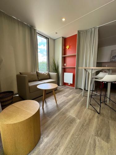 a living room with a couch and a table at Palazzo delle Biscie - Old Tower & Village in Molinella