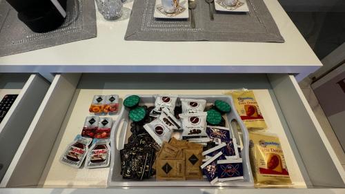a drawer in a table with food in it at Cagliari Love Suite in Cagliari