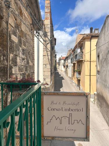 a sign on the side of a building on a street at Corso Umberto - apartment in the Molise hills in Tavenna