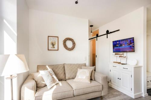 Televisyen dan/atau pusat hiburan di AnnaNordsee – Appartements