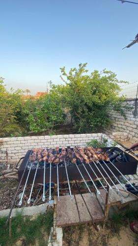 a grill with a bunch of food on it at استراحه أحمد سليم 