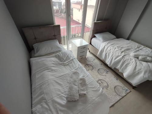 Katil atau katil-katil dalam bilik di Çam Suites