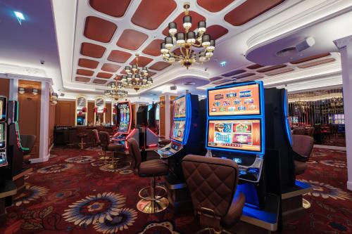 a casino with a bunch of slot machines at Boutique Hotel Porto Palace in Tivat