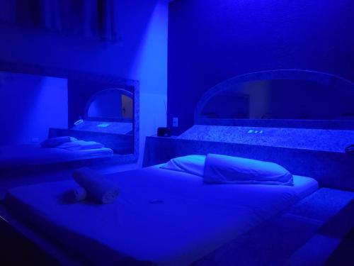 Postel nebo postele na pokoji v ubytování Alamo Motel