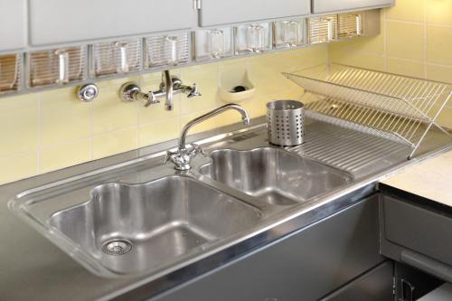 a stainless steel sink in a kitchen at Haus Erika in Alpirsbach