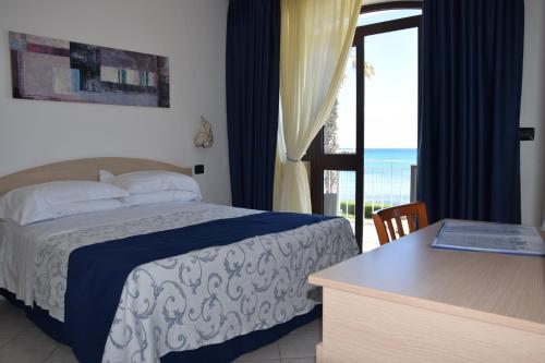 Cama o camas de una habitación en Hotel Profumo Di Mare