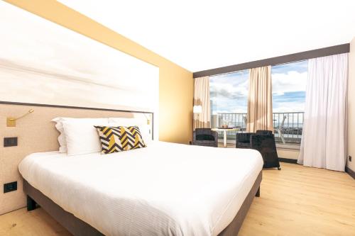 Ένα ή περισσότερα κρεβάτια σε δωμάτιο στο Hotel Ker Moor Saint-Quay Portrieux