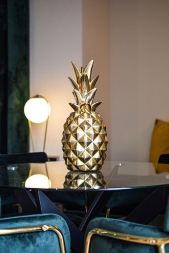 a pineapple sitting on a table in a room at Golden Rooms in Ioannina