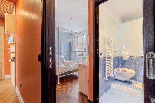 a bathroom with a toilet and a sink at Il Panoramico Rooms in Cagliari