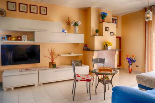a living room with a large flat screen tv at VILLA SOFIA in Montenero di Bisaccia