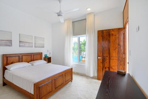 Postel nebo postele na pokoji v ubytování Enriquillo 2-Bedroom Apt Casa Areito