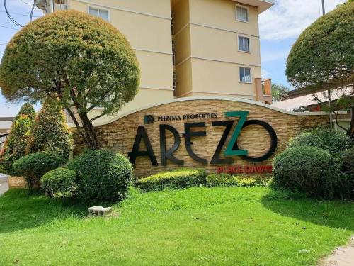 a sign that says aza in front of a building at Areezo Condo buhangin City Davao in Davao City