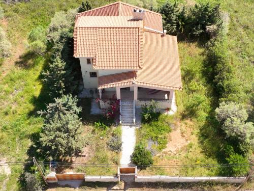 an aerial view of a house on a hill at Ancient Greek Villa in Schinias