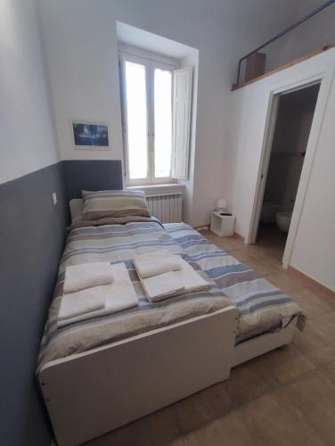 Posteľ alebo postele v izbe v ubytovaní Via Cavour